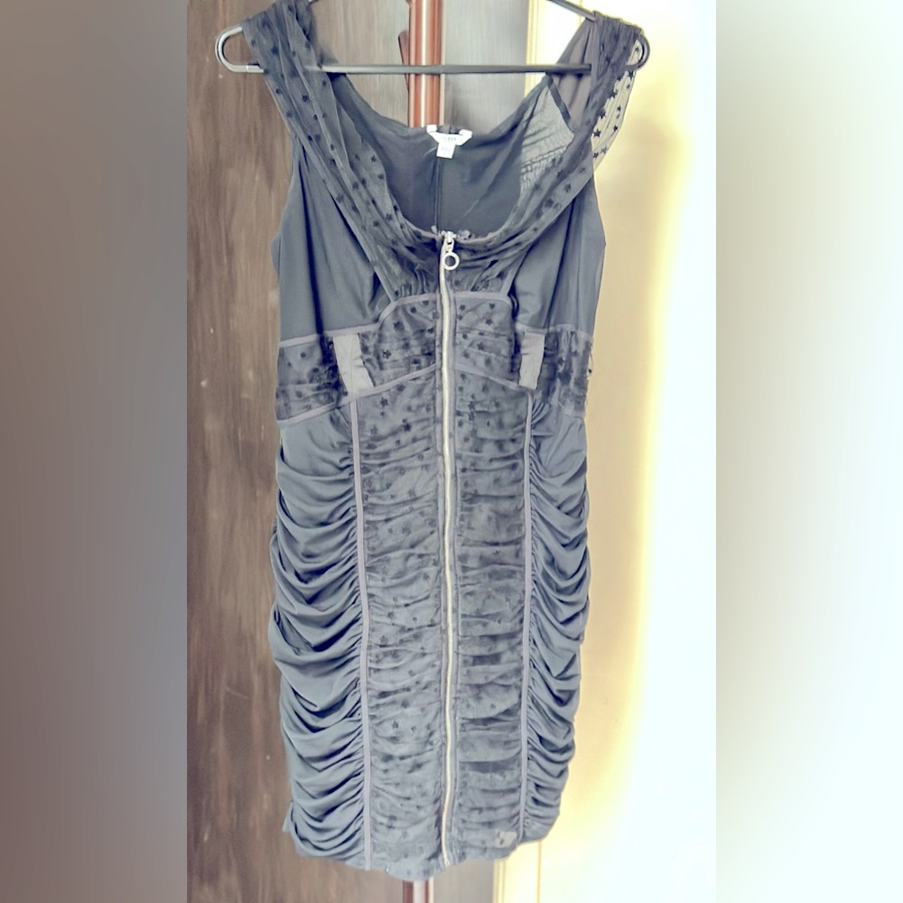 Guess black dress, lace and side ruffles, with front zip up closure.